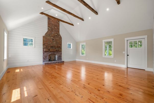 Empty room, Fireplace, Interior, Recessed Lighting, Stone Walls, Wooden Beams, Wood Texture Flooring