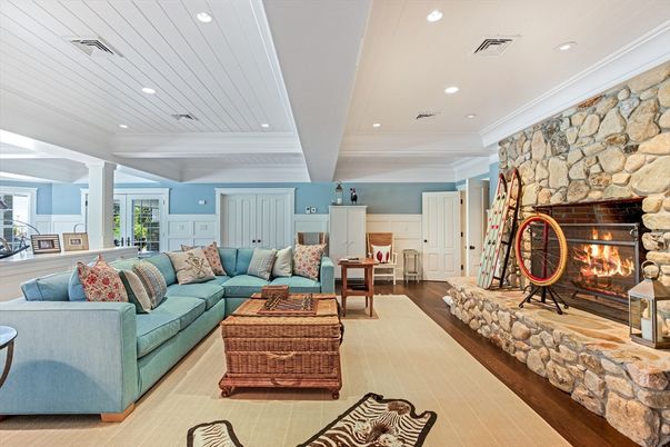 Fireplace, Interior, Living room, Recessed Lighting, Stone Walls, Wood Texture Flooring