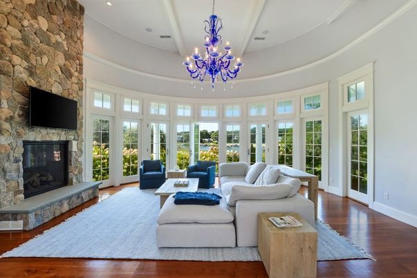 Chandelier, Fireplace, Interior, Living room, Recessed Lighting, Stone Walls, Wood Texture Flooring