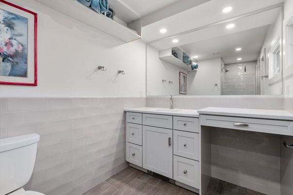 Bathroom, Dual Sink Vanities, Glass Shower, Interior, Recessed Lighting, Wood Texture Flooring