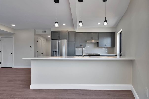 Interior, Kitchen, Pendant Lights, Recessed Lighting, Stainless Steel Appliances, Wood Texture Flooring