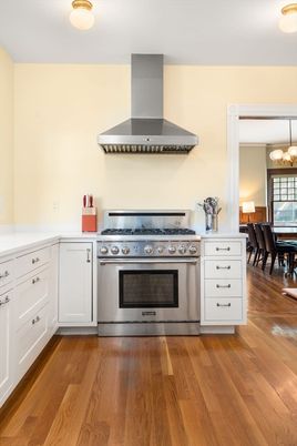 Chandelier, Dining room, Interior, Kitchen, Pendant Lights, Stainless Steel Appliances, Wood Texture Flooring