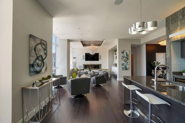 Chandelier, Fireplace, Interior, Kitchen, Living room, Pendant Lights, Recessed Lighting, Wood Texture Flooring