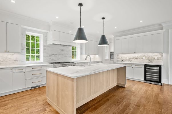 Interior, Kitchen, Marble Walls, Pendant Lights, Recessed Lighting, Stainless Steel Appliances, Wood Texture Flooring