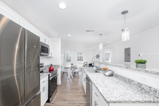 Dining room, Interior, Kitchen, Pendant Lights, Recessed Lighting, Stainless Steel Appliances, Wood Texture Flooring