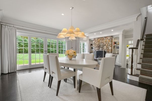 Chandelier, Dining room, Fireplace, Interior, Recessed Lighting, Stone Walls, Wood Texture Flooring