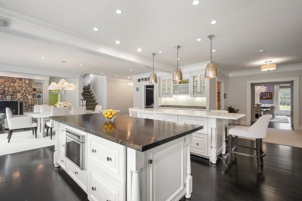 Dining room, Fireplace, Interior, Kitchen, Pendant Lights, Recessed Lighting, Stainless Steel Appliances, Stone Walls, Wood Texture Flooring
