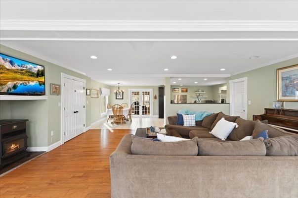 Chandelier, Dining room, Fireplace, Interior, Living room, Pendant Lights, Piano, Recessed Lighting, Wood Texture Flooring