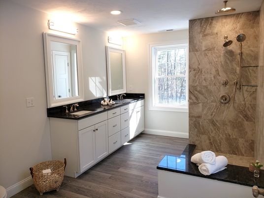 Bathroom, Dual Sink Vanities, Glass Shower, Interior, Marble Walls, Recessed Lighting, Wood Texture Flooring