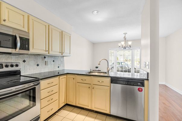Chandelier, Interior, Kitchen, Recessed Lighting, Stainless Steel Appliances, Wood Texture Flooring