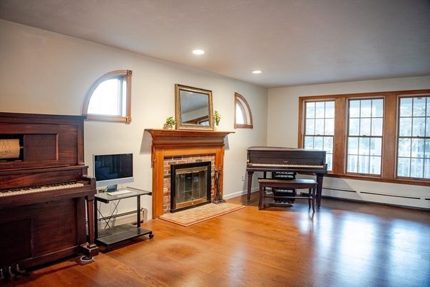 Fireplace, Interior, Piano, Recessed Lighting, Wood Texture Flooring
