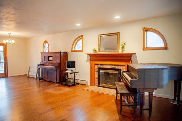 Chandelier, Fireplace, Interior, Piano, Recessed Lighting, Wood Texture Flooring