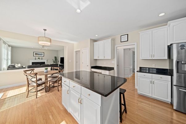 Chandelier, Dining room, Interior, Kitchen, Recessed Lighting, Stainless Steel Appliances, Wood Texture Flooring