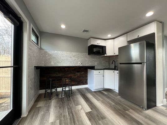 Interior, Kitchen, Recessed Lighting, Stainless Steel Appliances, Stone Walls, Wood Texture Flooring