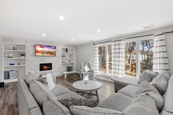 Fireplace, Interior, Living room, Recessed Lighting, Stone Walls, Wood Texture Flooring