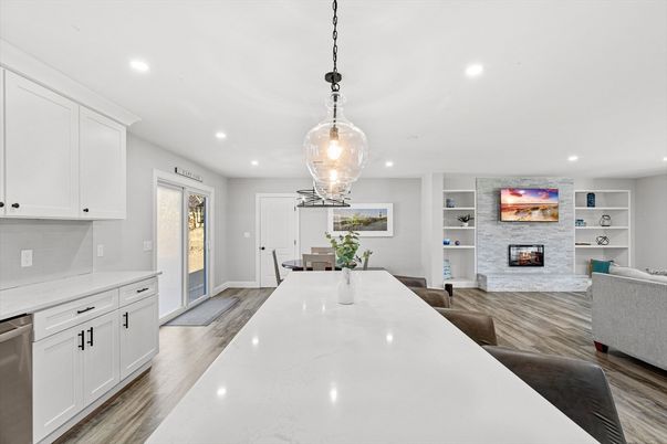 Dining room, Fireplace, Interior, Kitchen, Living room, Pendant Lights, Recessed Lighting, Stainless Steel Appliances, Stone Walls, Wood Texture Flooring