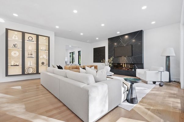 Fireplace, Interior, Living room, Marble Walls, Recessed Lighting, Wood Texture Flooring