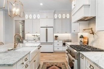 Chandelier, Interior, Kitchen, Pendant Lights, Recessed Lighting, Stainless Steel Appliances, Wood Texture Flooring