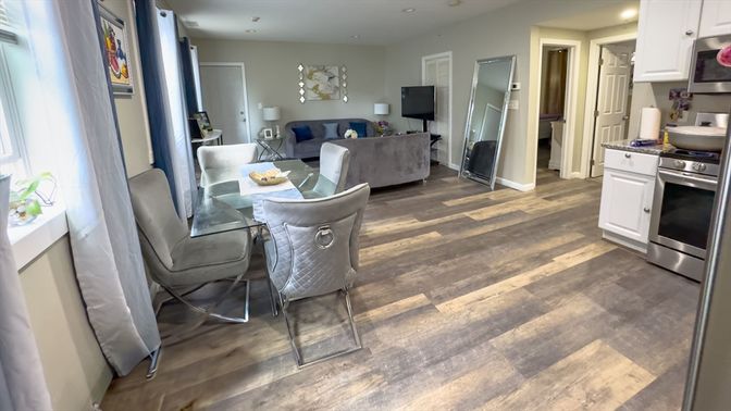 Dining room, Interior, Kitchen, Living room, Recessed Lighting, Stainless Steel Appliances, Wood Texture Flooring