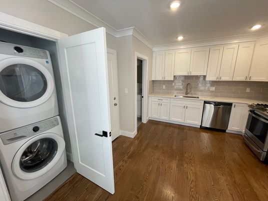 Interior, Kitchen, Recessed Lighting, Washer, Wood Texture Flooring