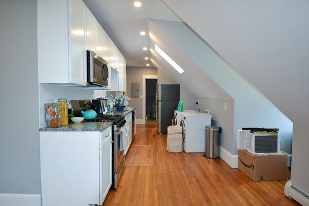 Interior, Kitchen, Recessed Lighting, Washer, Wood Texture Flooring