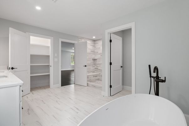 Bathroom, Dual Sink Vanities, Free Standing Baths, Interior, Marble, Marble Walls, Recessed Lighting