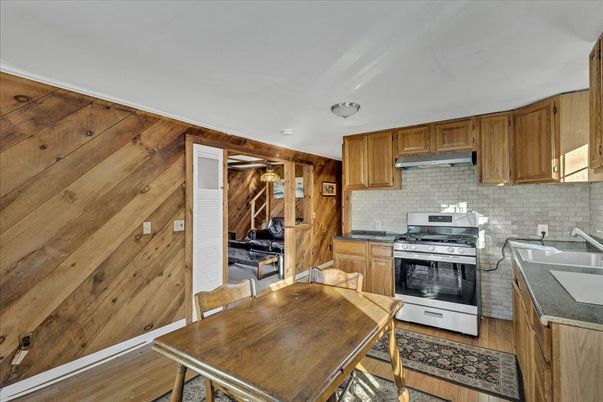Dining room, Interior, Kitchen, Stainless Steel Appliances, Wood Texture Flooring, Wooden Walls
