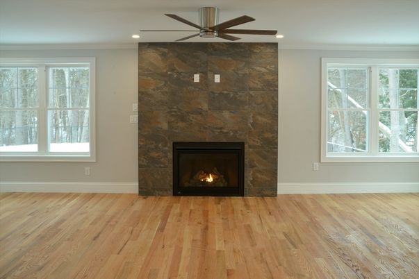 Empty room, Fireplace, Interior, Recessed Lighting, Stone Walls, Wood Texture Flooring