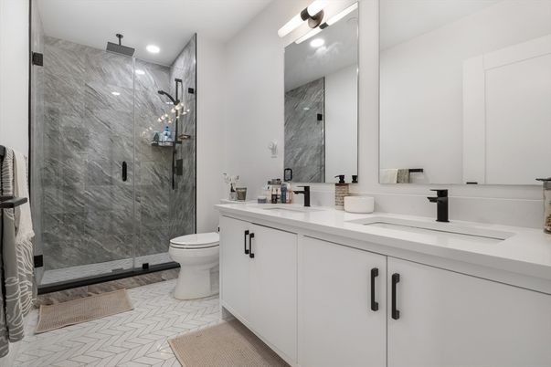 Bathroom, Dual Sink Vanities, Glass Shower, Interior, Marble Walls, Recessed Lighting