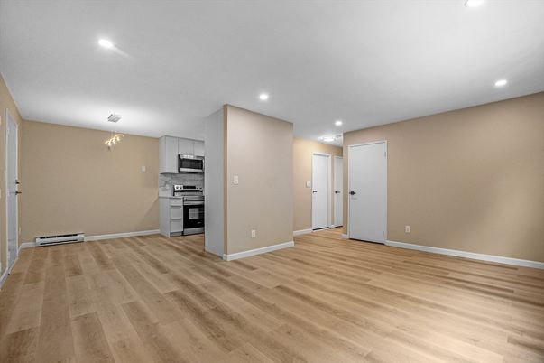 Chandelier, Empty room, Interior, Kitchen, Recessed Lighting, Stainless Steel Appliances, Wood Texture Flooring