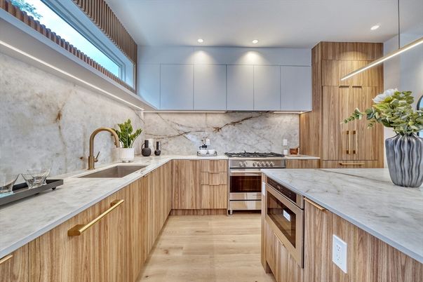 Interior, Kitchen, Marble Walls, Recessed Lighting, Stainless Steel Appliances, Wood Texture Flooring