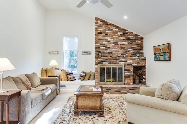 Fireplace, Interior, Living room, Recessed Lighting, Stone Walls, Wood Texture Flooring