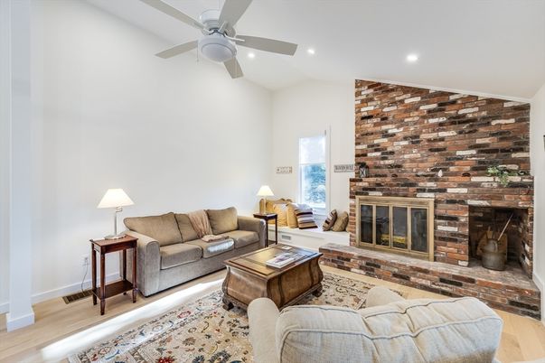 Fireplace, Interior, Living room, Recessed Lighting, Stone Walls, Wood Texture Flooring