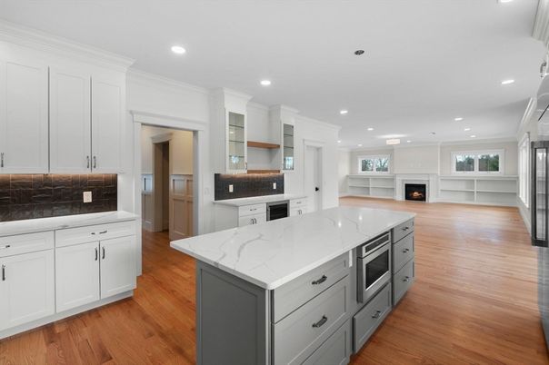 Fireplace, Interior, Kitchen, Recessed Lighting, Stainless Steel Appliances, Wood Texture Flooring