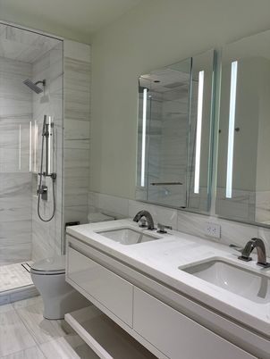Bathroom, Dual Sink Vanities, Glass Shower, Interior, Marble Walls, Wood Texture Flooring
