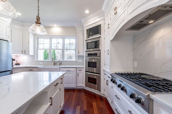 Interior, Kitchen, Marble Walls, Pendant Lights, Recessed Lighting, Stainless Steel Appliances, Wood Texture Flooring
