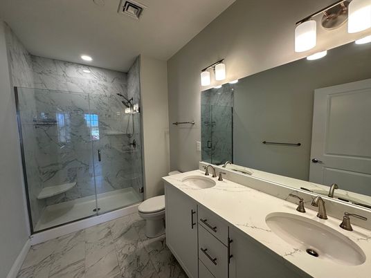 Bathroom, Dual Sink Vanities, Glass Shower, Interior, Marble, Marble Walls, Recessed Lighting