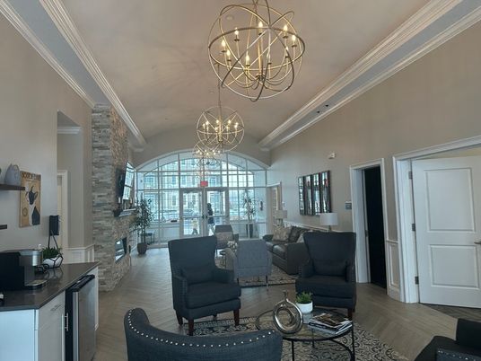 Chandelier, Fireplace, Interior, Living room, Pendant Lights, Stone Walls, Wood Texture Flooring