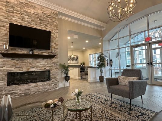 Chandelier, Fireplace, Interior, Kitchen, Living room, Pendant Lights, Recessed Lighting, Stone Walls, Wood Texture Flooring