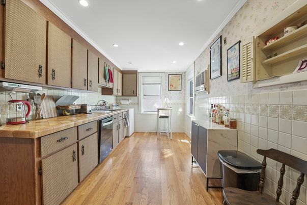 Interior, Kitchen, Recessed Lighting, Tile Countertops, Wood Texture Flooring