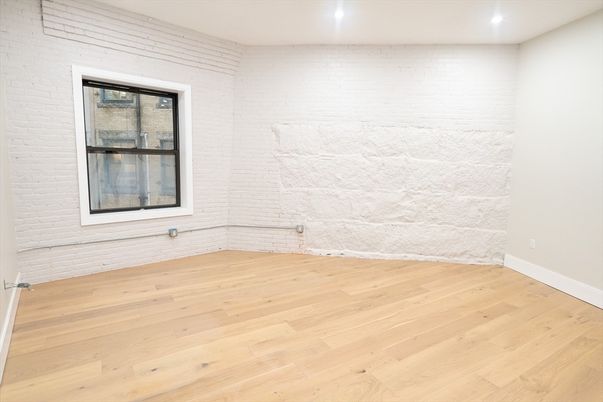 Empty room, Interior, Recessed Lighting, Stone Walls, Wood Texture Flooring