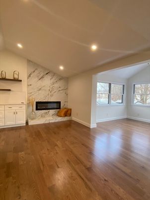 Empty room, Fireplace, Interior, Marble Walls, Recessed Lighting, Wood Texture Flooring