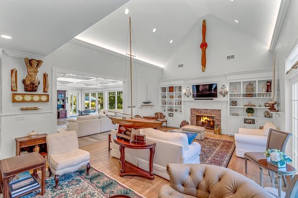 Fireplace, Game Room, Interior, Living room, Pendant Lights, Recessed Lighting, Wood Texture Flooring