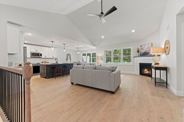 Fireplace, Interior, Kitchen, Living room, Pendant Lights, Recessed Lighting, Stainless Steel Appliances, Wood Texture Flooring