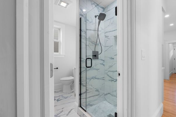 Bathroom, Glass Shower, Interior, Marble, Marble Walls, Recessed Lighting, Wood Texture Flooring