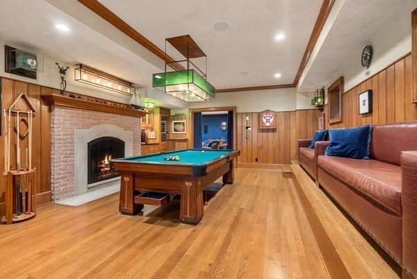 Billiard Table, Fireplace, Game Room, Interior, Pendant Lights, Recessed Lighting, Stone Walls, Wood Texture Flooring, Wooden Walls
