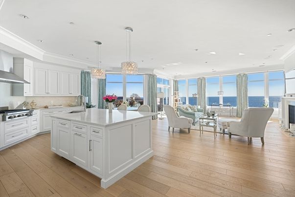 Chandelier, Dining room, Fireplace, Interior, Kitchen, Living room, Pendant Lights, Recessed Lighting, Stainless Steel Appliances, Water, Wood Texture Flooring