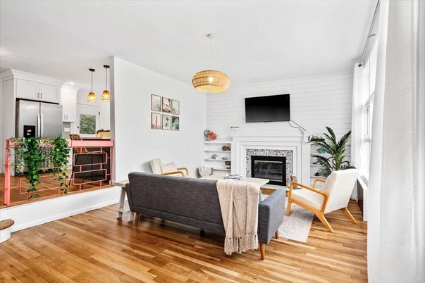Fireplace, Interior, Kitchen, Living room, Pendant Lights, Stainless Steel Appliances, Wood Texture Flooring