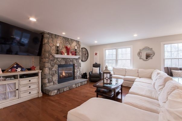 Fireplace, Interior, Living room, Recessed Lighting, Stone Walls, Wood Texture Flooring