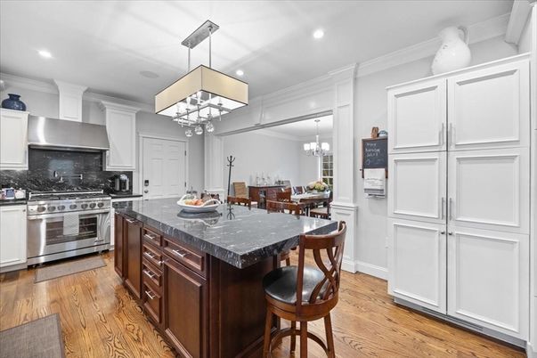 Chandelier, Dining room, Interior, Kitchen, Pendant Lights, Recessed Lighting, Stainless Steel Appliances, Wood Texture Flooring